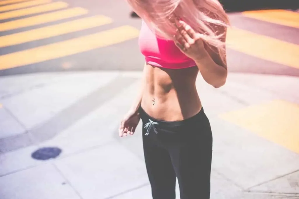 Woman with toned stomach after LA-EMS Body Sculpting Treatment Barrow